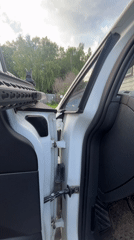 Armed individual recorded handling rifle in vehicle near Vasilyevo