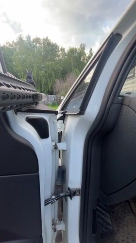 Armed individual recorded handling rifle in vehicle near Vasilyevo