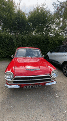 Red vintage Ford Cortina parked in Giverny, France