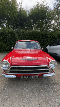 Red vintage Ford Cortina parked in Giverny, France
