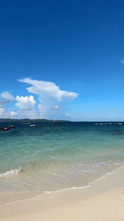 Sunny morning on a rocky, turquoise shoreline in Phru Nai