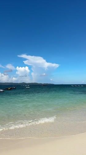 Sunny morning on a rocky, turquoise shoreline in Phru Nai
