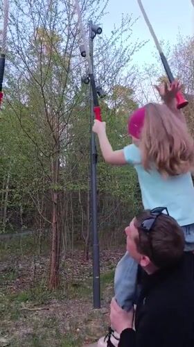 Father, daughter enjoy playground time in Chernogolovka park