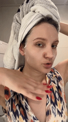 Woman applies face mask during skincare routine in Esenyurt
