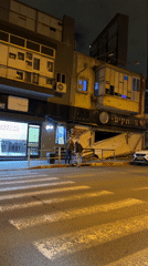 Nighttime street activity and building damage in Givatayim