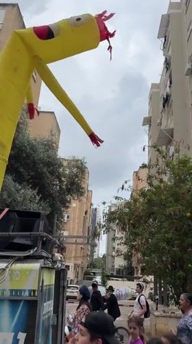 Children's parade with flags and drummers marches through Netanya