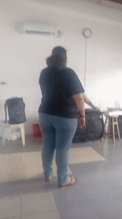 Woman sings with keyboardist in Juan Griego rehearsal space