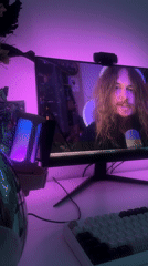 Purple-lit desk setup captured in Khimki with monitor display