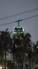 Cable car operates amid illuminated skyline in Bai Chay Ward