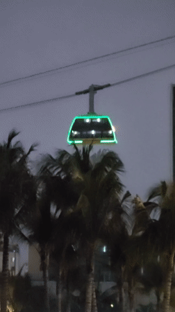 Cable car operates amid illuminated skyline in Bai Chay Ward