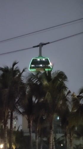 Cable car operates amid illuminated skyline in Bai Chay Ward