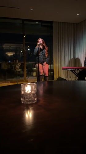 Red-haired performer gives late-night West Hollywood show with piano