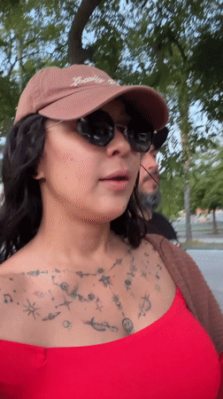Woman with red flower spotted walking in Barcelona