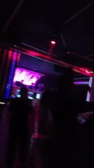 Nightclub patrons celebrate with drinks and selfies early Sunday morning