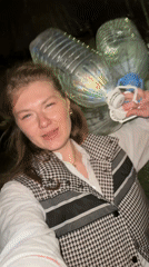 Woman carries water bottles in Kazan, Russia