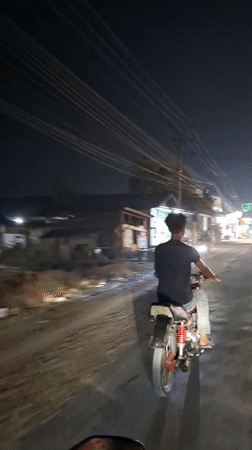 Nighttime motorcycle ride documented in Blangpeuria, Indonesia