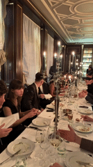 Young adults gather for formal dinner in Paris