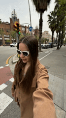 Woman documents beauty routine while filming selfies across Barcelona