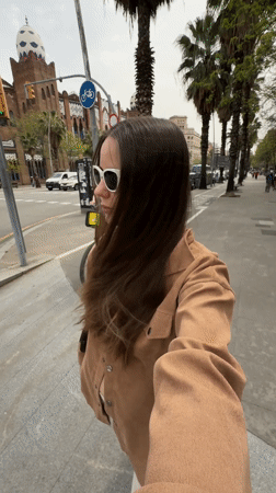 Woman documents beauty routine while filming selfies across Barcelona