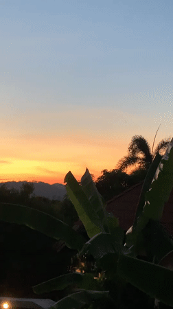 Vibrant sunset captured over tropical landscape in Thailand