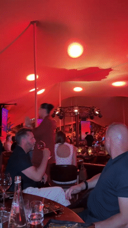 Red-lit tented party night in Cannes