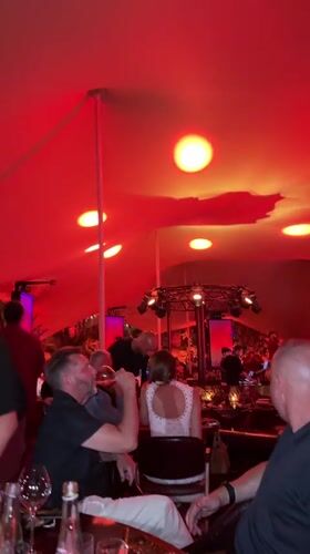 Red-lit tented party night in Cannes
