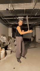 Nunchaku practice in a bare concrete room, Qarağandı