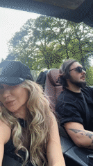 Couple spotted driving convertible through sunny Wassenaar streets
