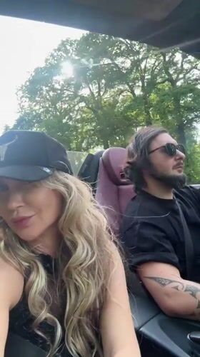 Couple spotted driving convertible through sunny Wassenaar streets