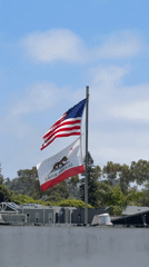 Flags wave in evening breeze in Encinitas, California