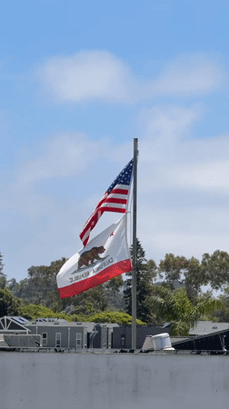 Flags wave in evening breeze in Encinitas, California
