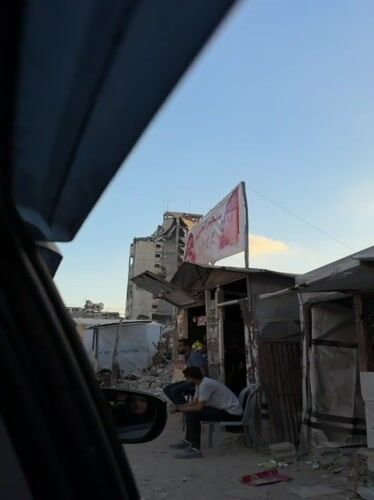 Makeshift shop open on a rubble-lined Gaza street