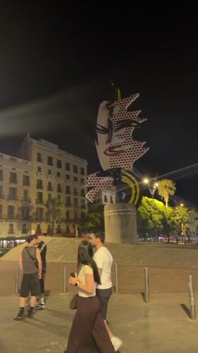 Colorful pop art sculpture glows at night in Barcelona