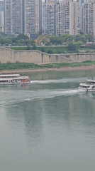 Passenger boats cruise Chongqing river during morning hours
