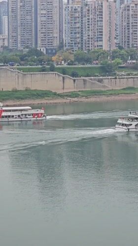 Passenger boats cruise Chongqing river during morning hours
