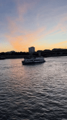 Dusk colors paint Budapest's Danube during evening hour