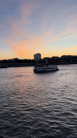 Dusk colors paint Budapest's Danube during evening hour