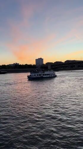Dusk colors paint Budapest's Danube during evening hour