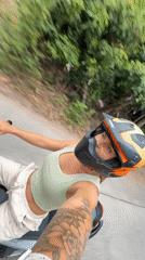 Motorcycle rider cruising through Ko Samui streets