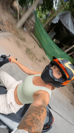 Motorcycle rider cruising through Ko Samui streets