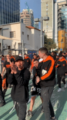 Group in team colors marches through Tel Aviv streets