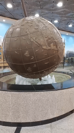 Shopper documents Alice in Wonderland sculptures at Yekaterinburg mall