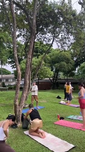 Morning park activity in Chiang Mai: yoga, gym, and basketball