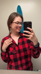Woman documents evening selfie session in Budapest apartment