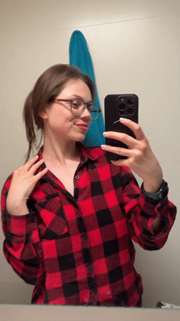 Woman documents evening selfie session in Budapest apartment