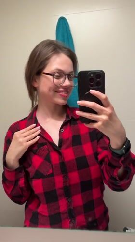 Woman documents evening selfie session in Budapest apartment