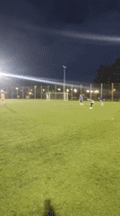 Nighttime soccer on artificial turf, scoreboard showing 18