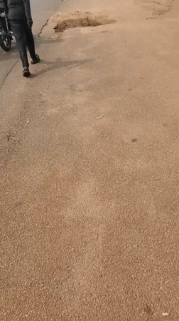 Everyday street life moving through Jos neighborhoods