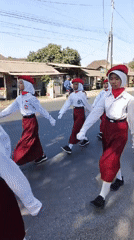 Multi-group parade fills Kasiyan Timur streets on a sunny morning