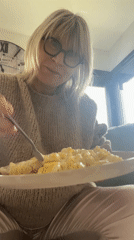 Woman takes selfies at home with cat in Chambœuf